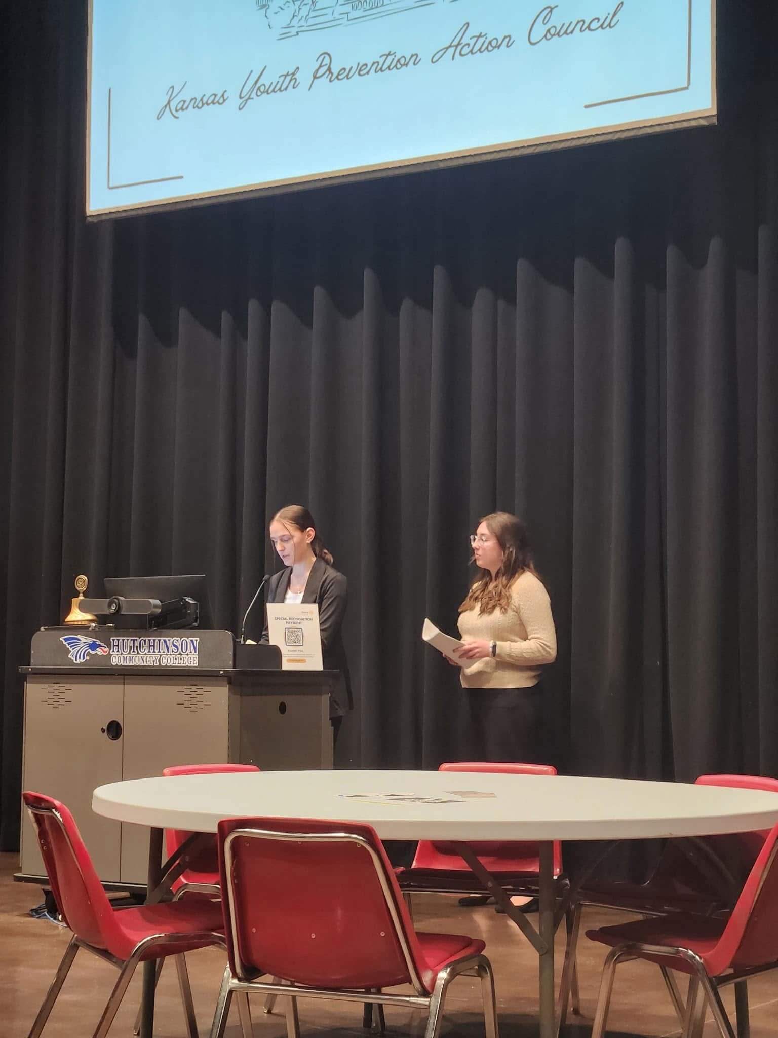 Ellie Speaking at a Community Event